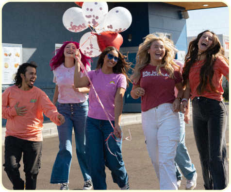 group of girls with balloons in front of dutch bros