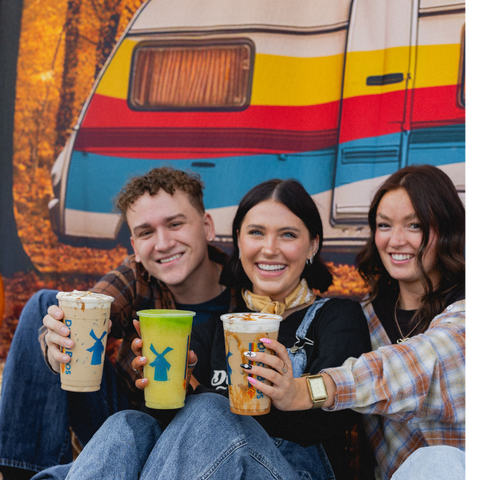 In Fall We Wear Flannel - Trio of People Holding Drinks